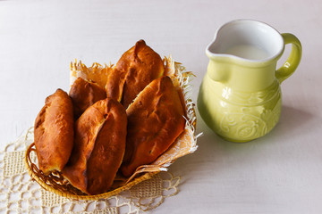 Freshly baked homemade pies with a glass of milk