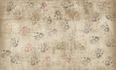 Hand prints on the wall in different colors