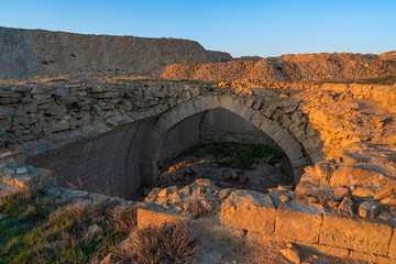 Ruins of an ancient caravanserai of the 14th century, located in the Gobustan steppes, Azerbaijan - obrazy, fototapety, plakaty