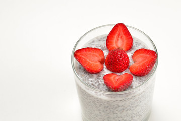 Chia pudding with strawberry on a white background. Space for text or design.