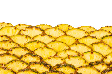 Pineapple juicy yellow slices background. Top view.