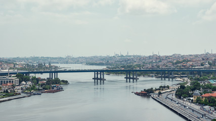 Aerial view on bridge across the Bosphorus river and Istanbul beautiful cityscape in evening. Time lapse Turkey