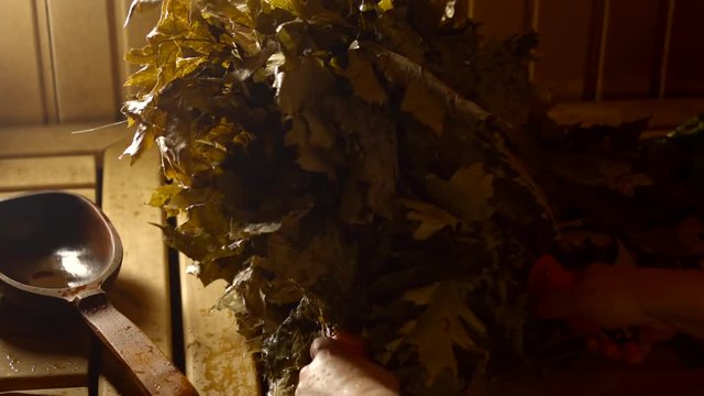 Spa procedure in the bath. Steaming and removing the toxin from the skin with dob branches and steaming