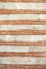 background of stone wall with red stripes, texture