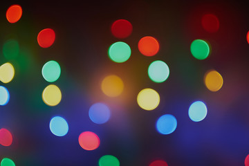 Blur background texture bokeh red, blue, yellow, green, round, hearts. Unfocused abstract Christmas background