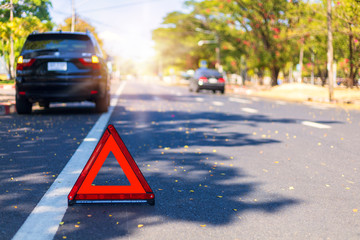 Red triangle, red emergency stop sign, red emergency symbol with  car stop and park on road.