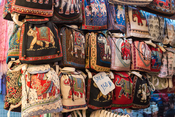 Fototapeta na wymiar Handicraft elephants weave backpack selling at the market in Bangkok,Thailand.