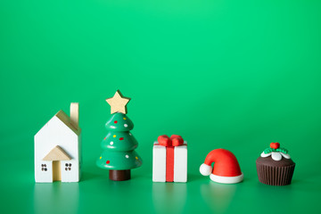 Christmas decorative toys on green background