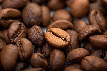 Coffee beans close-up background. Fresh roasted