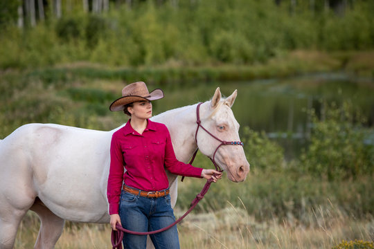 cowgirl with white horse