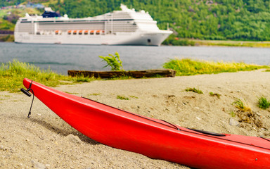 Kayak and cruise ship in Flam, Norway