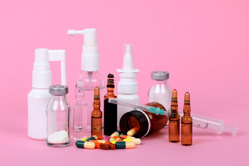medical bottles isolated on pink background, drugs and