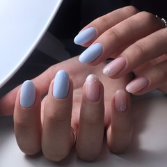 Woman with flesh-colored manicure with design, close up