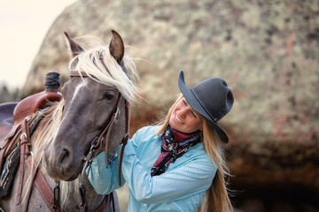 cowgirl with rocky mountain horse
