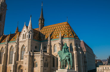 Naklejka na ściany i meble Detail of Matthias Church, located in Budapest, Hungary, in front of the Fisherman's Bastion at the hill of Buda's Castle District 