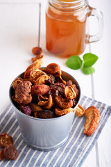 Dried fruits and Homemade compote of dried fruits in a jar on a light table. Vertical Close up