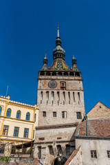 Fototapeta na wymiar The clock tower in old town of Sighisoara afternoon during spring season . One of the most impotant tower . Also Sighisoara is Unesco sites of the country , Sighisoara , Transylvania , Romania