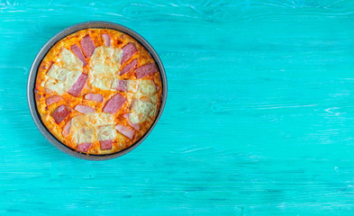 Pizza with cheese and ham. Photographed close-up.