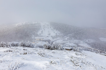 Fototapeta na wymiar Navacerrada ski resort in Madrid, covered by snow