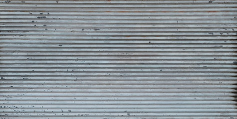 metal shutter background texture on store or shop front -