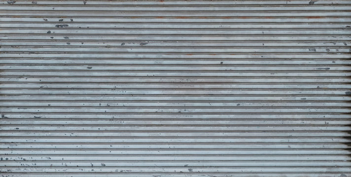 metal shutter background texture on store or shop front -