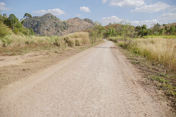 Fototapeta na wymiar Dust Road go to countryside