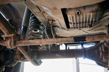 Car repair at a service station. Photo of spare parts and technical units.