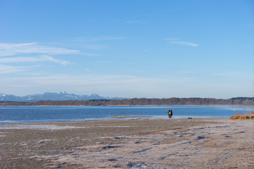 walking on a pier at the lake on a bright sunny morning