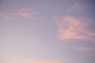Naklejka na ściany i meble Photography of pink clouds on a blue sky.