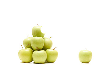 Bitten apple among whole ones