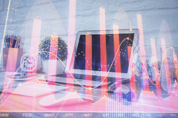 Stock market graph and table with computer background. Multi exposure. Concept of financial analysis.