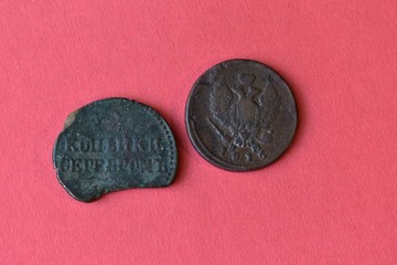 Vintage coins, tokens and badges close-up.