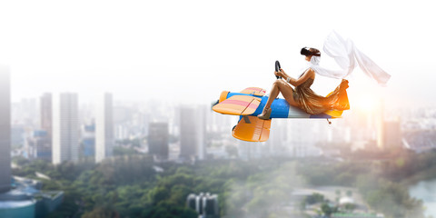 Woman in retro airplane . Mixed media