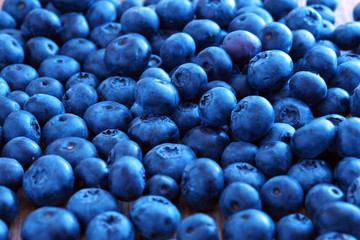 Blueberry berry on a wooden table. Summer and vitamins