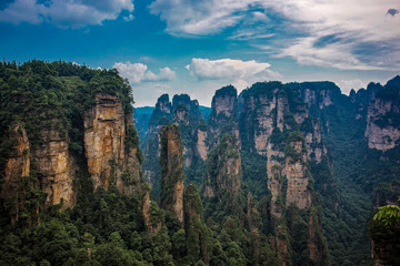 Fototapeta na wymiar Amazing view of natural quartz sandstone pillar the Avatar Hallelujah Mountain among green woods and rocks in the Tianzi Mountains, the Zhangjiajie National Forest Park, Hunan Province, China.