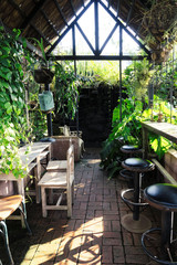 Bar counter and chairs with garden view 