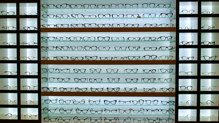 Numbered glasses frames in optical store. Glasses shop. Optician. Glasses.