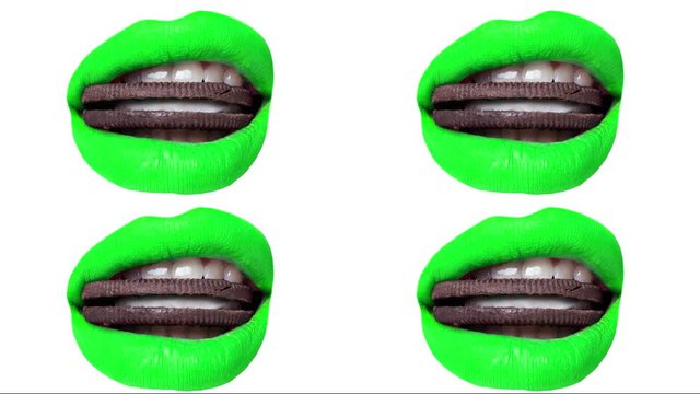 Stop motion. Multi-colored lips with cookies in the mouth. Close up on a white isolated background.