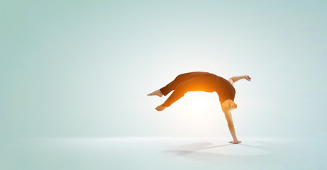 Fototapeta premium Dancer guy in jump. Mixed media