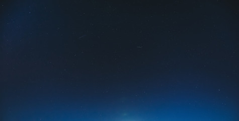 Fototapeta na wymiar Night Starry Sky With Glowing Stars. Night Starry Sky Blue Background Backdrop