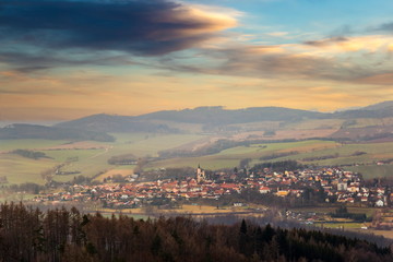 Evening sky over gothic Church of the Assumption in the Bavorov. Romantic citiscape in Czech Republic, Central Europe.