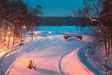Gomel, Belarus. City Park In Winter Night. Old Bridge And Frozen Pond In Homiel Park, Belarus....
