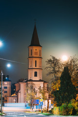 Ruzhany, Brest Region, Belarus. Rising Moon Above Trinity Church In Autumn Night. Famous Historic Landmark
