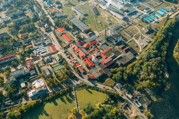 Fototapeta premium Dobrush, Gomel Region, Belarus. Aerial View Of Old And Modern Paper Factory. Historical Heritage In Bird's-eye View