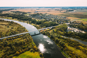 Chachersk, Belarus. Aerial View Of Bridge over the Sozh river In Summer Day. Top View Of Beautiful European Nature From High Attitude In Summer Season. Drone View. Bird's Eye View