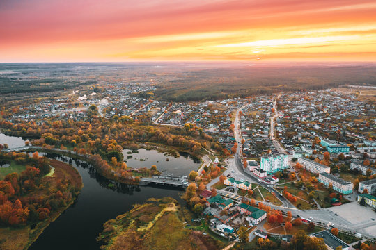 Dobrush, Gomel Region, Belarus. Aerial View Of Dobrush Cityscape Skyline In Autumn Evening. Residential District And River During Sunset. Bird's-eye View
