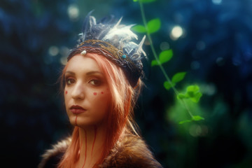 beautiful shamanic woman with headband in the nature.