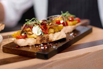 Italian bruschetta or sandwich with tomato and basil fresh summer seasonal food