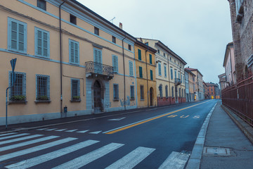 Naklejka premium Old empty street early morning view in Ravenna, Italy
