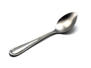 shiny stainless steel spoon in isolated on white background
